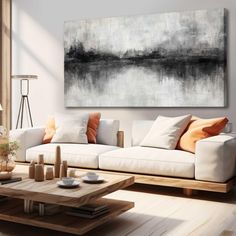 a living room filled with furniture and a painting on the wall above it's coffee table