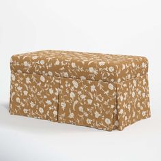 a brown and white floral print storage box