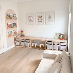 a living room filled with furniture and lots of storage