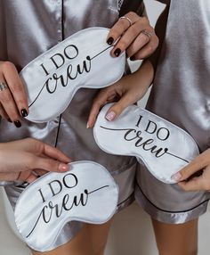 three women in silver pajamas holding i do crew masks