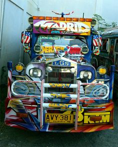 an old school bus painted with american flags