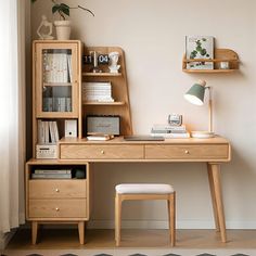 a desk with a chair and bookshelf next to it