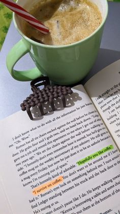 a cup of coffee and an open book