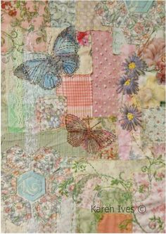 a patchwork quilt with butterflies and flowers on the front, in pastel colors