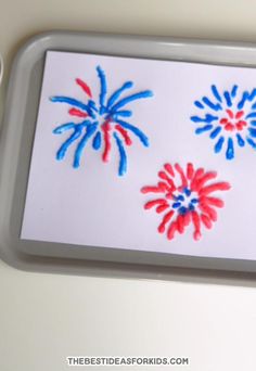 a tray with some red, white and blue handprinted fireworks on the side