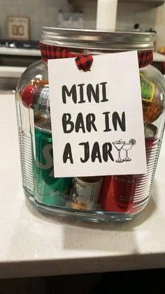 a mini bar in a jar with a sign attached to it that says,'mini bar in a jar '