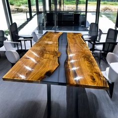 a table made out of wood with chairs around it