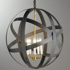 an orb chandelier with three candles in it