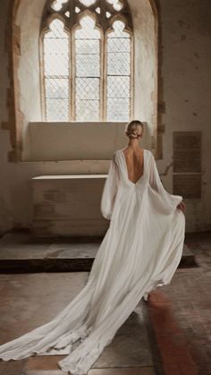 the back of a woman's dress in front of a window