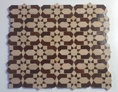 a brown and white tile pattern on the wall