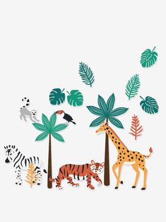 paper cut out of animals and trees on a white background