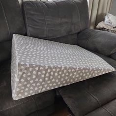 a couch with a pillow on top of it