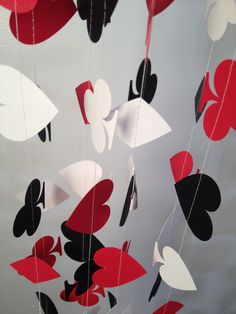 red, black and white paper hearts hanging from strings