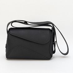 Evelyn Crossbody – Features a unique, curvy silhouette with a sleek finish, combining modern aesthetics with timeless elegance. Materials: Made from durable, high-quality leather. Functional Interior: 1 compartment with a zipper and pocket. Shoulder Strap: 38 inches long Curvy Silhouette, Functional Interior, Modern Aesthetics, Black Cross Body Bag, Shopping Trip, Free Bag, High Quality Leather, Everyday Look, Cross Body Handbags