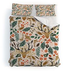 an image of a bed set with deer and flowers on the comforter sheet cover