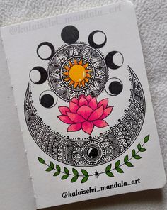 an intricately designed card with a lotus flower on the front and two moon phases in the back