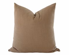 a brown pillow on a white background