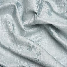 an up close shot of a light blue fabric