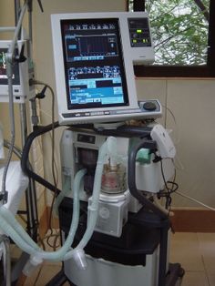 an operating room with monitors and medical equipment