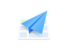 a blue paper airplane sitting on top of a map