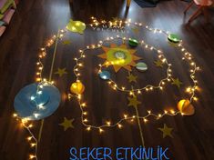 a wooden floor with lights on it and the words seeker etnikk written in blue