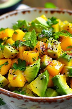 a bowl filled with sliced up fruit and herbs