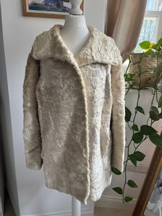 Beautiful full length vintage Astrakhan fur jacket in a white/cream fur.  At least 60 years old. Grey lining with German manufacturing tag  Hook and eye closures.  Size M UK depending on fit  Measurements: Shoulder to shoulder: 49cm Bust: 54cm Arm: 57cm Length: 72cm Condition: Great vintage condition as show in images Fur Coat White, Vintage Fur Coat, White Fur Coat, Fur Coat Vintage, Coat White, Amazing Lace, Vintage Fur, White Coat, Mid Century Vintage