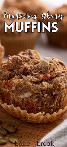 a muffin sitting on top of a wooden cutting board next to other muffins