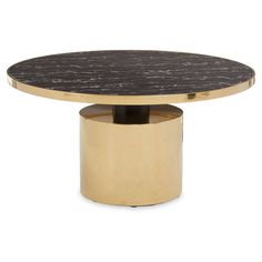 a round table with a black marble top and gold metal base, against a white background