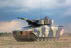 a camouflaged tank is moving through the field with dark clouds in the sky behind it