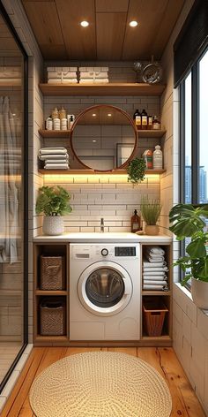 a washer and dryer in a small room with wood flooring on the side