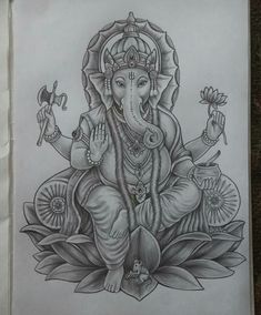 an elephant sitting on top of a flower next to a drawing of ganesha