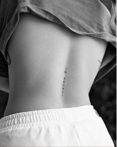 the back of a woman's stomach with an inscription on it that says no secret