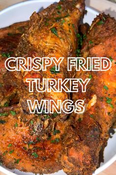 crispy fried turkey wings in a white bowl with the words crispy fried turkey wings