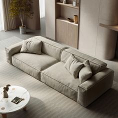 a living room filled with furniture and a coffee table