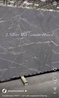 a granite counter top with the words silver mist granite hound written on it in black and white