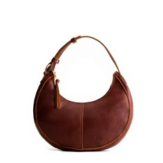 Nutmeg*Classic | Crescent shaped shoulder bag with zipper closure and adjustable strap Italian Honeymoon, Dragon Bones, Portland Leather Goods, Classic Purse, Crescent Bag, Best Crossbody Bags, Leather Stand, Puffy Jacket, Almost Perfect