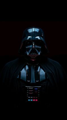 darth vader in the dark with his helmet on