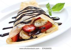 a crepe filled with bananas, strawberries and chocolate