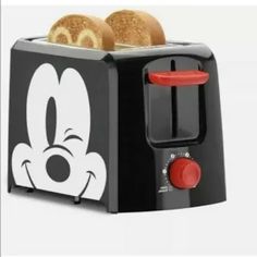 a mickey mouse toaster with two pieces of bread in it