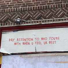 a sign on the side of a building that says pay attention to who you're with when u feel up best