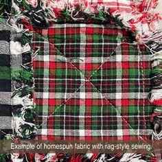 an image of a plaid fabric with tassels on the edges and in the middle