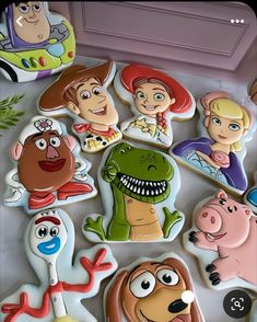 there are many decorated cookies with cartoon characters on the top one is for children's birthdays