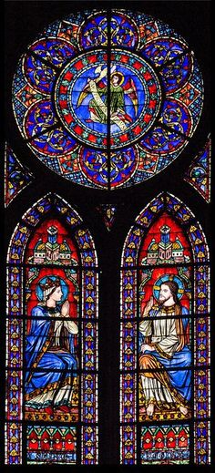 two stained glass windows in a church