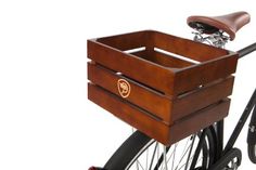 a wooden box on the back of a bicycle