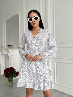 White Mini Wrap Dress with Bishop Sleeves    *SIZE OF ITEM:  S BUST    32,3 - 35,4 inches or 82 - 90 cm WAIST  25,2 - 27,6 inches or 64 - 70 cm HIPS     un  M BUST    33,9 - 37 inches or 86 - 94 cm WAIST  26,8 - 29,1 inches or 68 - 74 cm HIPS     un   *COLOR: Black     *MATERIAL: soft, consists of viscose and polyester *LINING: No *CLOSURE: Ties *MEASUREMENTS OF THE MODEL IN PHOTO/VIDEO: Model is wearing Size S, her height is 5,6 feet or 170 cm *HANDLING:  Hand wash or delicate wash,  water temp White V-neck Surplice Neckline Dress For Brunch, White Long Sleeve V-neck Dress For Brunch, White Long Sleeve V-neck Dress For Summer, White Long Sleeve V-neck Summer Dress, Chic White Wrap Dress With Surplice Neckline, V-neck Polka Dot Dress For Brunch, White Long Sleeve Wrap Dress For Spring, Polka Dot V-neck Dress For Brunch, White Long Sleeve Wrap Dress For Brunch