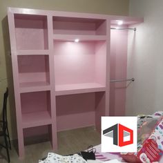 there is a pink shelf in the room