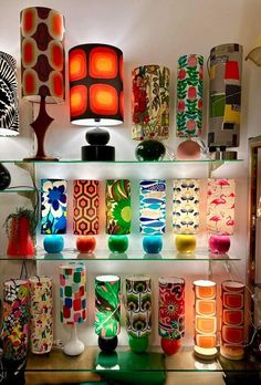 many colorful vases and lamps are on display