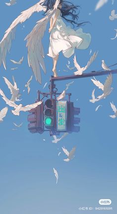 a woman standing on top of a traffic light surrounded by white birds in the sky