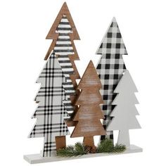 three wooden christmas trees with black and white plaid designs